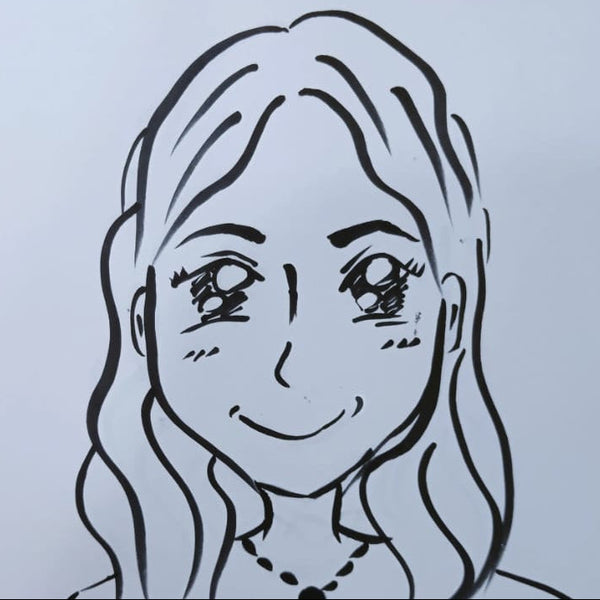 Hand-drawn portrait of a smiling face with long hair on a white sheet of paper.