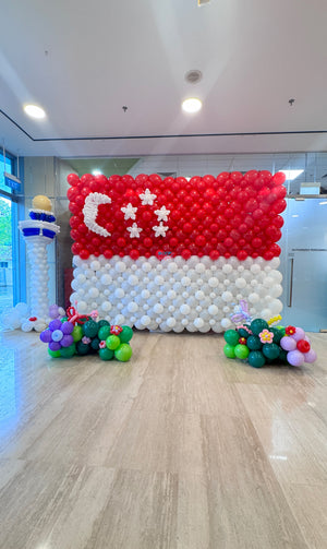AIA National Day 2025 balloon decoration setup in Singapore with red and white themed event styling