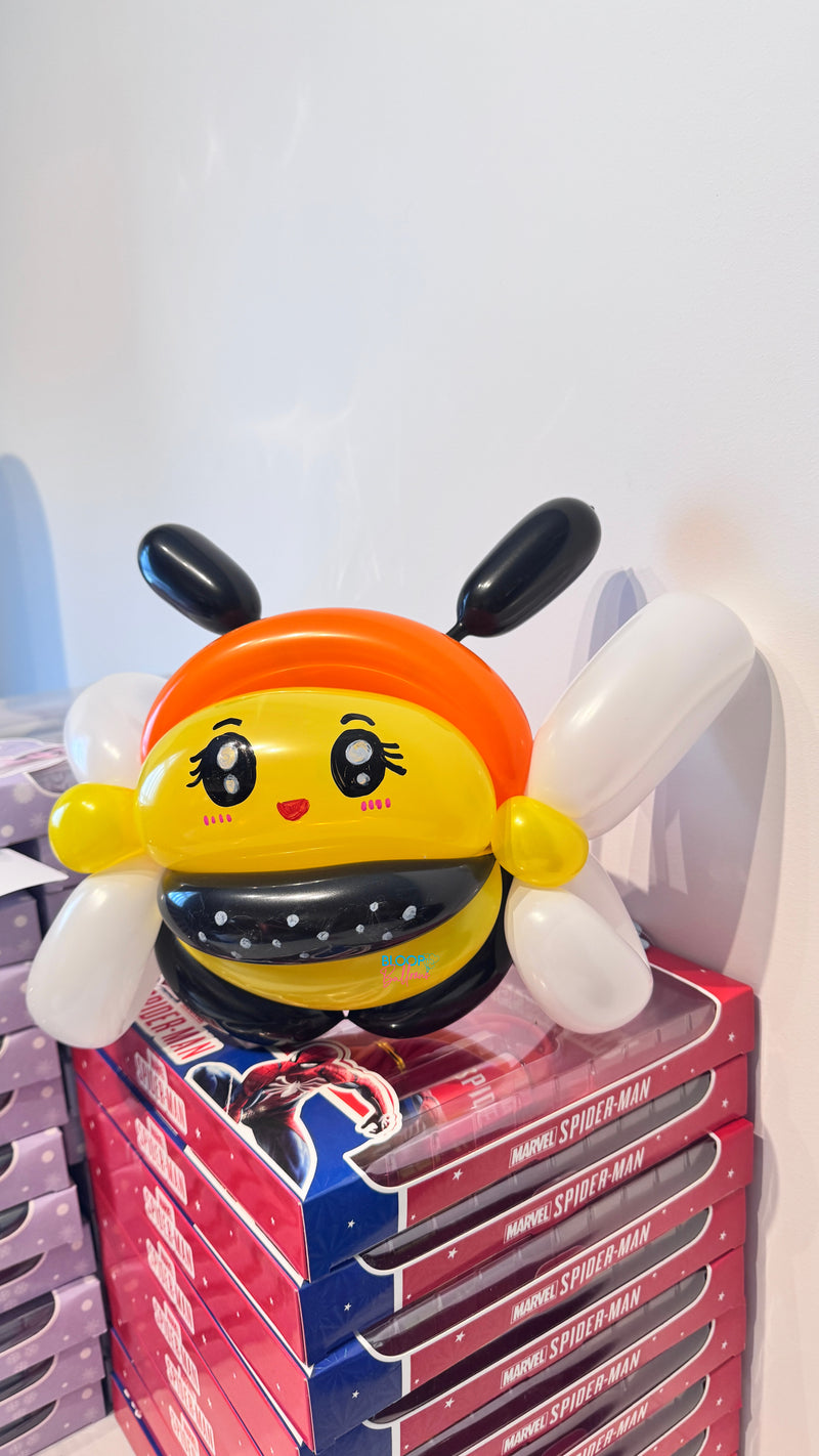 Bee balloon sculpting design in orange, yellow and black for kids birthday party in Singapore by Bloop Balloons