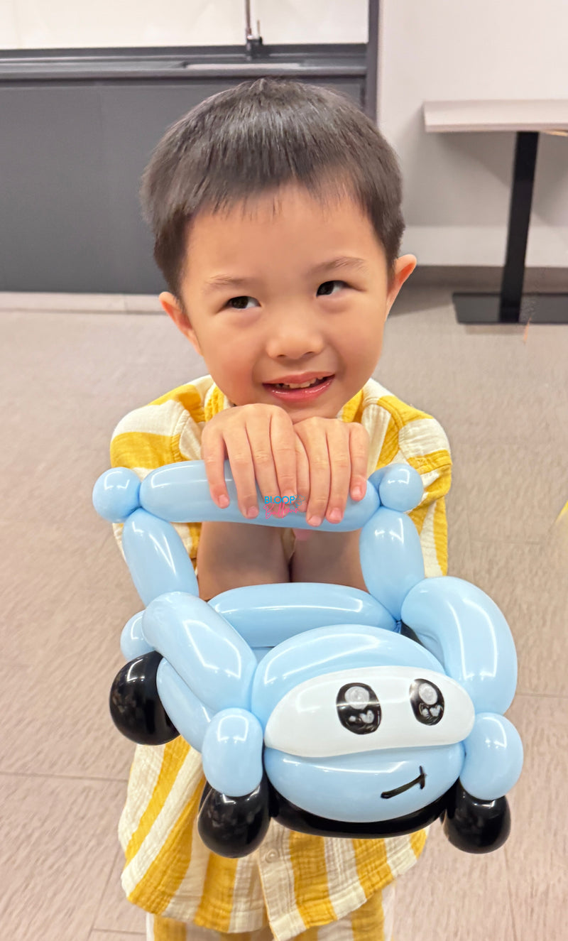 Blue balloon car sculpting design for kids birthday party in Singapore by Bloop Balloons