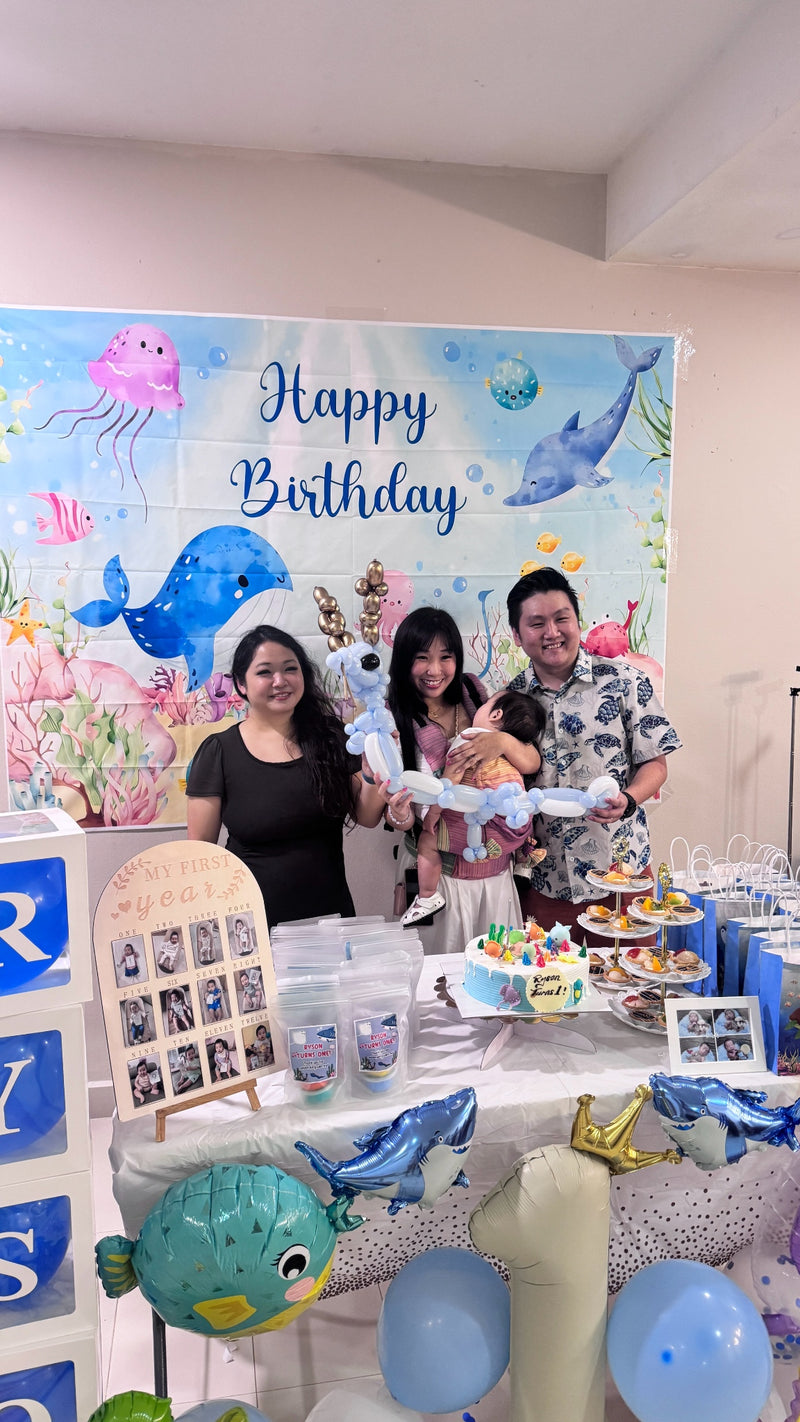Balloon sculpting dragon in blue and white made for a children's birthday party
