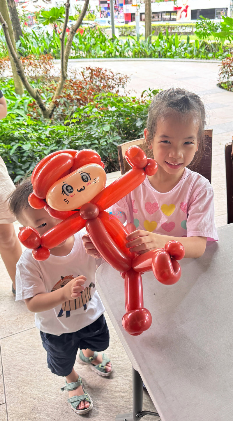Monkey balloon sculpting at Jimmy Monkey event in Singapore by Bloop Balloons