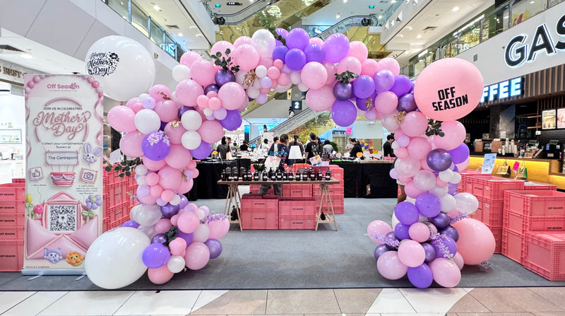 Pink and purple Mother's Day balloon arch at Centrepoint Singapore, designed for Off Season Beauty beauty roadshow and shopping mall event decoration