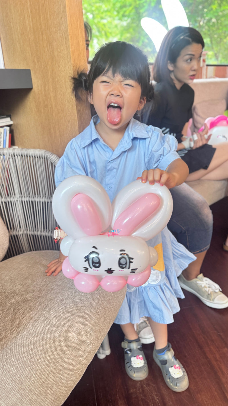 Pink and white rabbit balloon sculpting design for kids birthday party in Singapore by Bloop Balloons