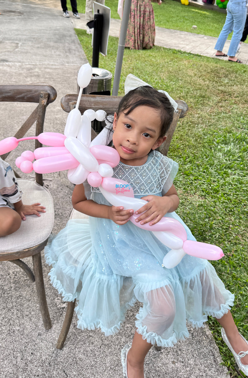Pink and white butterfly balloon sculpting design for kids birthday party in Singapore by Bloop Balloons