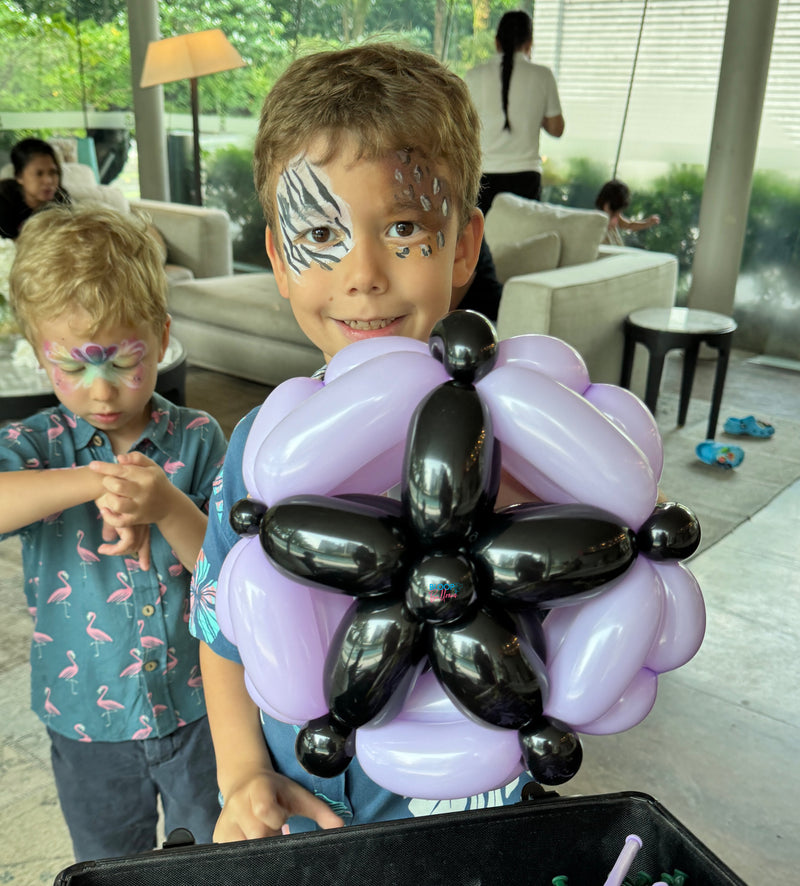 Purple and black balloon shield sculpting design for kids party in Singapore by Bloop Balloons