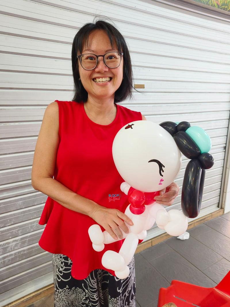 Snoopy balloon sculpting at 69 Geylang Bahru hawker centre event in Singapore by Bloop Balloons