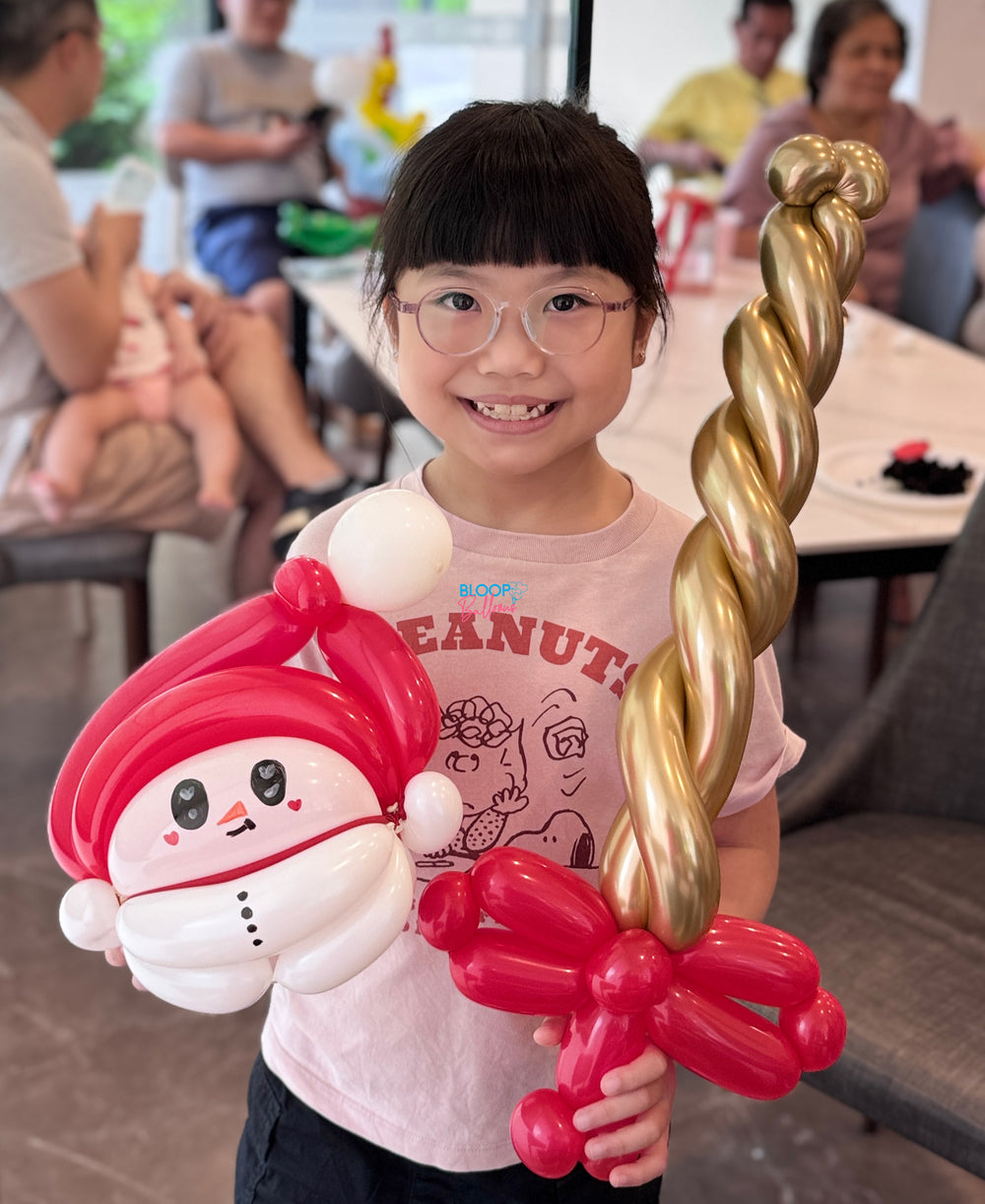 Snowman and sword balloon sculpting designs for kids birthday party in Singapore by Bloop Balloons